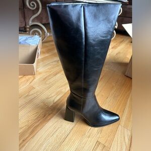Size 10 black heeled boots New in box never worn
